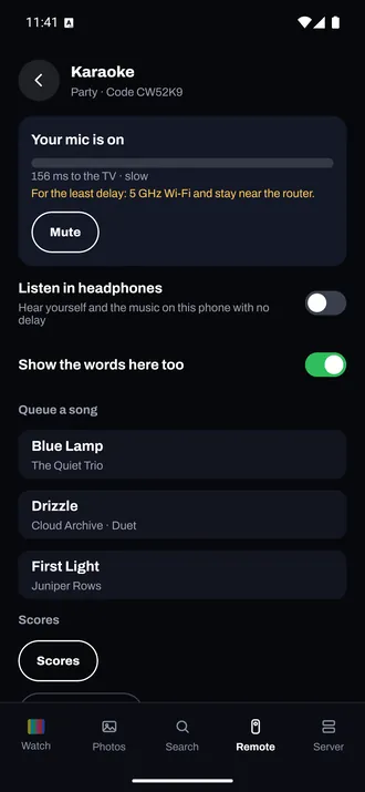 A phone as the karaoke microphone: Your mic is on, with songs to queue, one of them a duet.